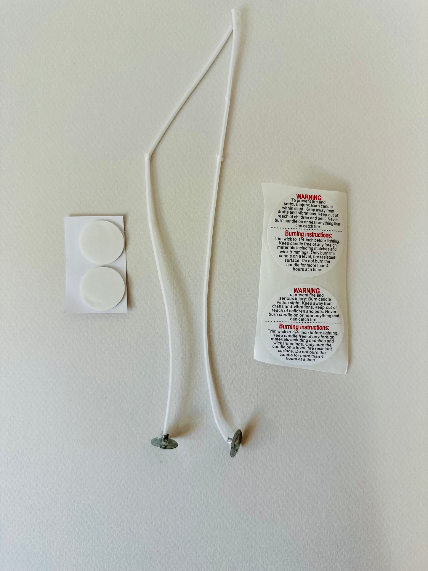 Rewick & Chill candle refill kit featuring two cotton wicks, two wick tabs, and a pouch of pre-scented soy wax, displayed beside a reusable candle vessel—perfect for refilling 8 to 12 oz jars and promoting eco-friendly candle use
