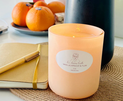 
Floral and fruity candle in 8 oz matte sage and 12 oz matte peach jars, styled in a cozy, elegant space—capturing year-round charm and a timeless, classy feel.