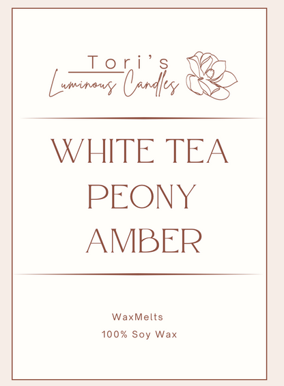 White tea, peony, and amber soy wax melts in modern packaging, offering a fresh floral and warm home fragrance.
